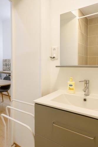 a bathroom with a sink and a mirror at Escape Studio ! Cozy & practical in Seclin Center in Seclin