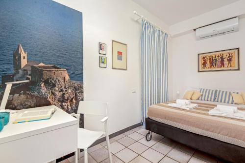 En eller flere senge i et værelse på CasaSolemare Terrace seaview AC