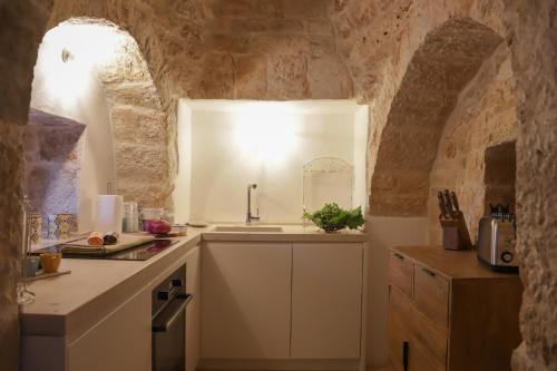 Kuchyň nebo kuchyňský kout v ubytování TD Trulli Balice Cozy Trulli with Pool