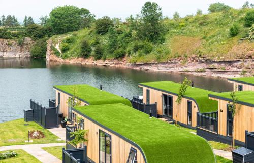 a row of tiny houses with grass on the roofs at Landal Ullswater Heights in Great Blencow