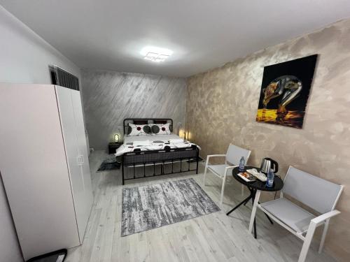 En eller flere senge i et værelse på Rinn Residence