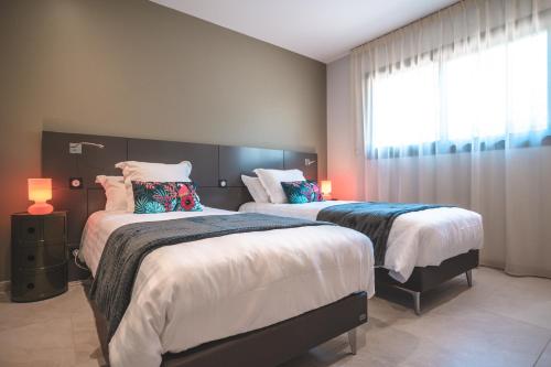 Кровать или кровати в номере Villa Romana 4 personnes