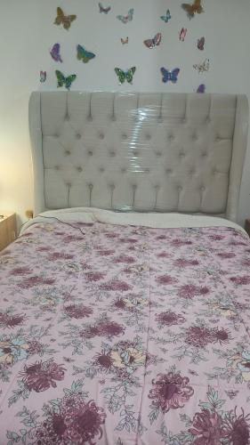 Giường trong phòng chung tại Casa cerca a la playa