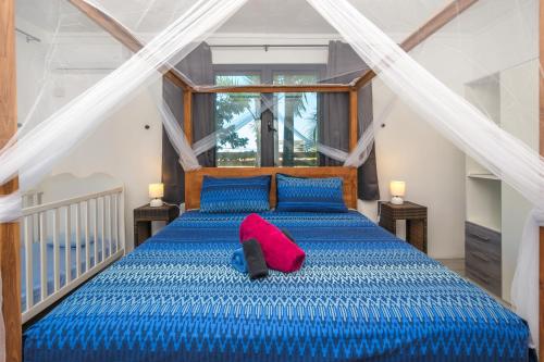 Ένα ή περισσότερα κρεβάτια σε δωμάτιο στο The Rusty Pelican