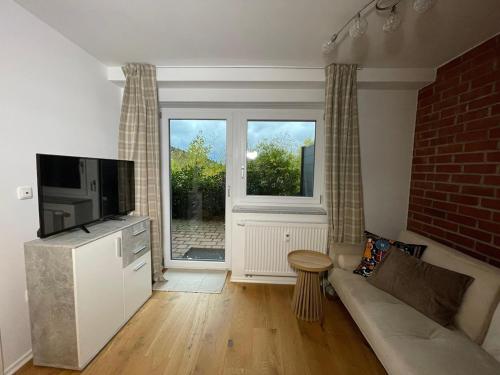 TV a/nebo společenská místnost v ubytování Haus Schönblick Ferienwohnung am Skilift