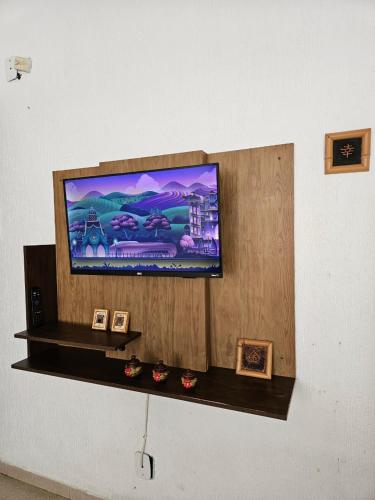 Et tv og/eller underholdning på Edifício Açucena Beira Mar - Praia do Tombo