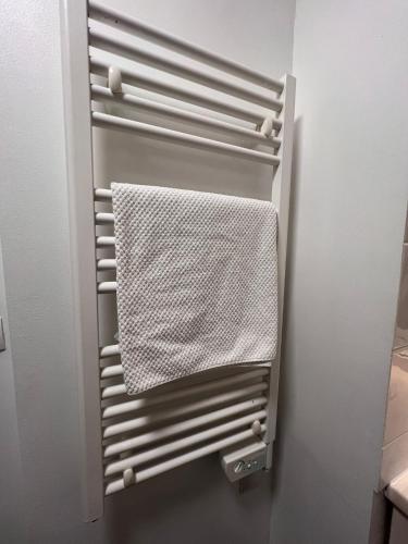 a towel rack on a refrigerator in a kitchen at Appart'Hotel - Gare TGV - Courtine - Confluence - 407 bis in Avignon