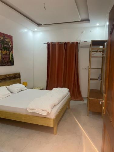 Postel nebo postele na pokoji v ubytování Keur back to teranga Cozy F2 calme aux Mamelles