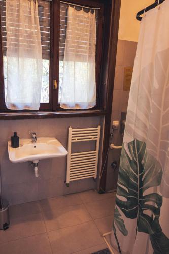 a bathroom with a sink and a window at OstellOlinda in Milan