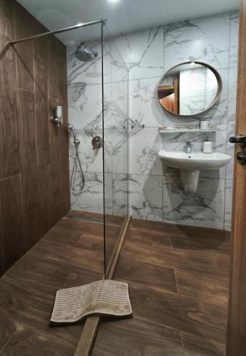 a bathroom with a shower and a sink at Borovets Dream Studio in Borovets