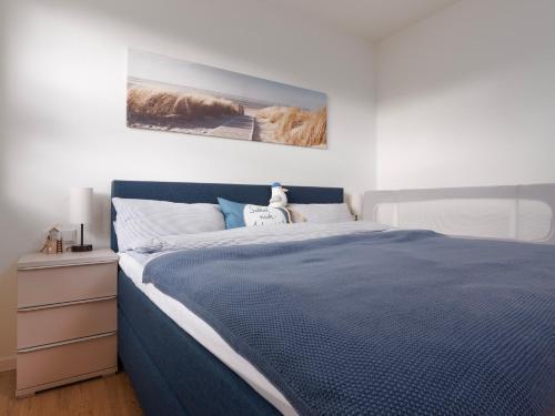 Ένα ή περισσότερα κρεβάτια σε δωμάτιο στο Küste33-22 Lotta