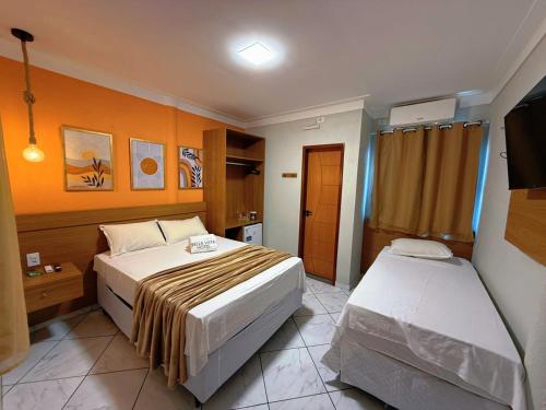 Ένα ή περισσότερα κρεβάτια σε δωμάτιο στο Bella Vista Hotel