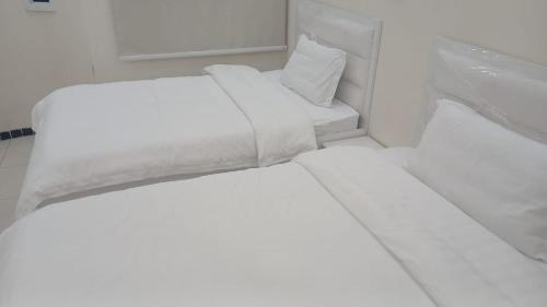 Postel nebo postele na pokoji v ubytování سويت اليمامه للشقق المخدومه