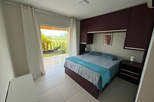 En eller flere senge i et værelse på Apartamento Térreo em Resort