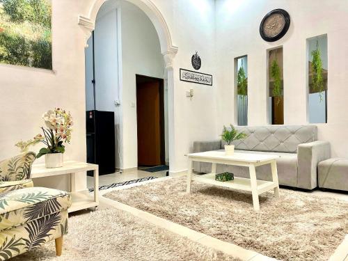 Posezení v ubytování Laman Maslinda Homestay