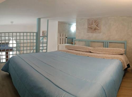 Ένα ή περισσότερα κρεβάτια σε δωμάτιο στο chicca marina