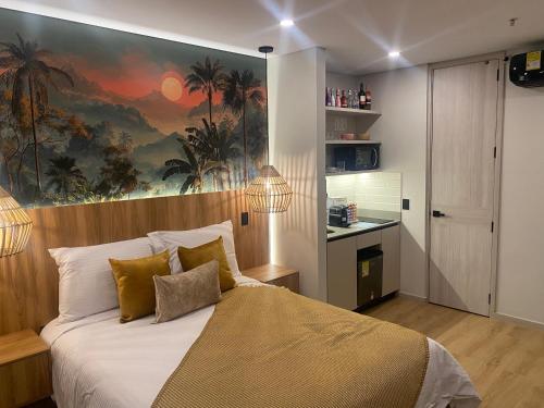 a bedroom with a bed with a painting on the wall at Hotel Ryo 74b Piso 7 Vip in Medellín