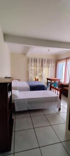 Postel nebo postele na pokoji v ubytování Margarida pousada