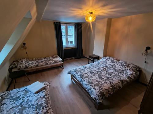 Ένα ή περισσότερα κρεβάτια σε δωμάτιο στο Wrocławska 7