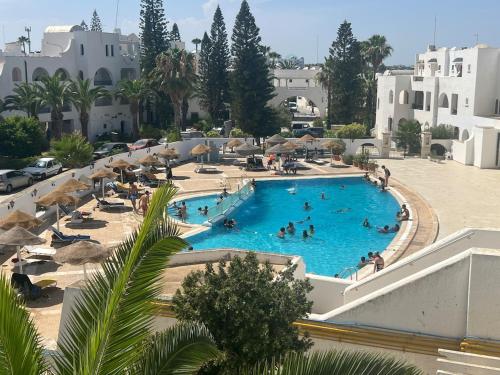 Bazén v ubytování Vue mer Marina Kantaoui - pieds dans l'eau, calme nebo v jeho okolí