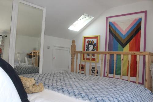a bedroom with a bed and a painting on the wall at Blarney Street in Cork