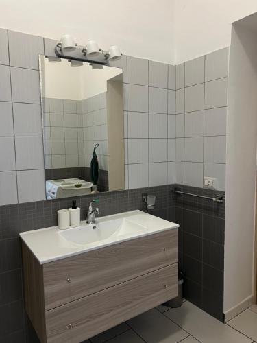a bathroom with a sink and a mirror at A casa di Rita in Agropoli