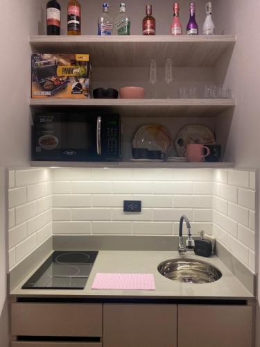 a kitchen with a sink and a counter top at Hotel Ryo 74b Piso 7 Vip in Medellín
