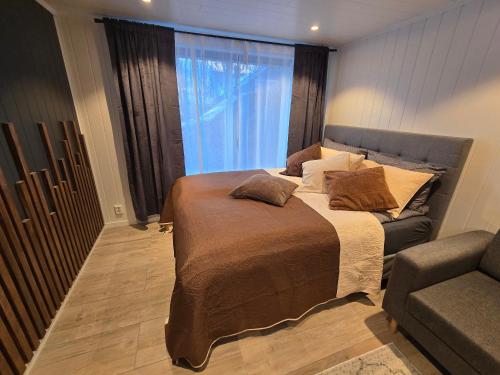 Ένα ή περισσότερα κρεβάτια σε δωμάτιο στο Nord Hus Service AS Nr 2