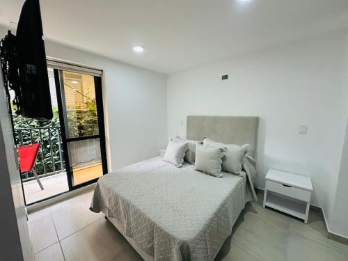 Postel nebo postele na pokoji v ubytování hito 201- Amplio y comodo Apartamento en Laureles