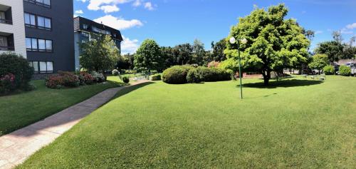 Zahrada ubytování Céntrico departamento a pasos del lago