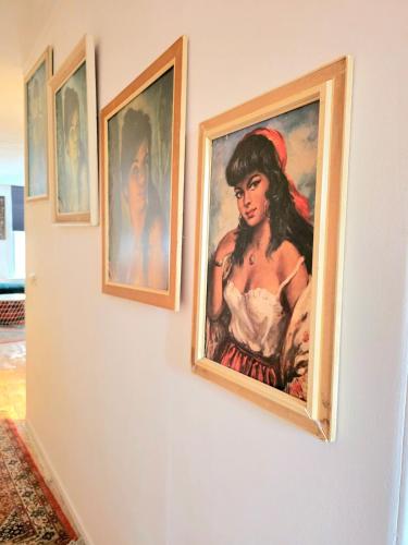 a painting of a woman hanging on a wall at Homely 2Bedroom in the Center of Eindhoven in Eindhoven