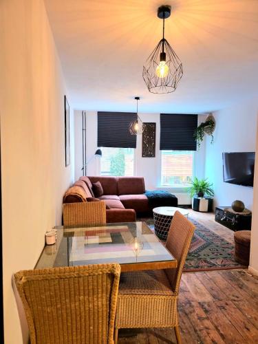 a living room with a couch and a table at Homely 2Bedroom in the Center of Eindhoven in Eindhoven