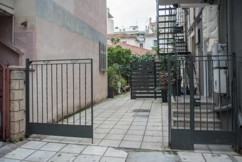 an entrance to a building with an iron gate at City Central Apartment with Parking in Larisa