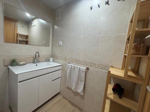 a bathroom with a sink and a mirror at Apartamento Clotilde Lloret in Lloret de Mar