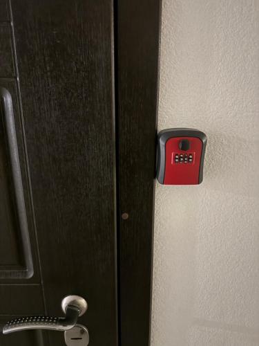 a door with a clock on the side of it at VIP Apartments 9 in Odesa