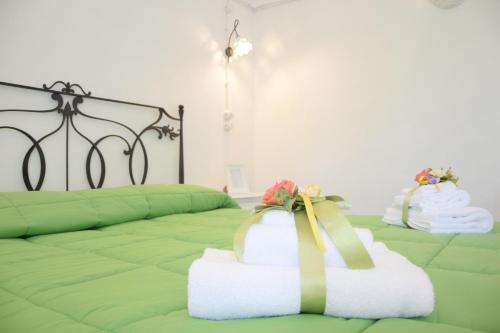 Postel nebo postele na pokoji v ubytování Corte Trullo Sovrano B&B