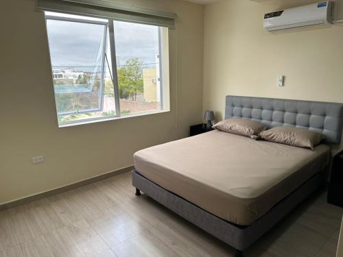 Ένα ή περισσότερα κρεβάτια σε δωμάτιο στο Apartamento en Manta