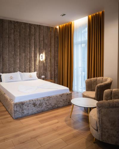 מיטה או מיטות בחדר ב-Leo Hotel