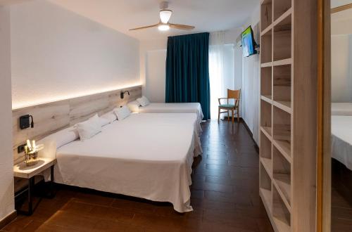 Ένα ή περισσότερα κρεβάτια σε δωμάτιο στο Hotel Bersoca