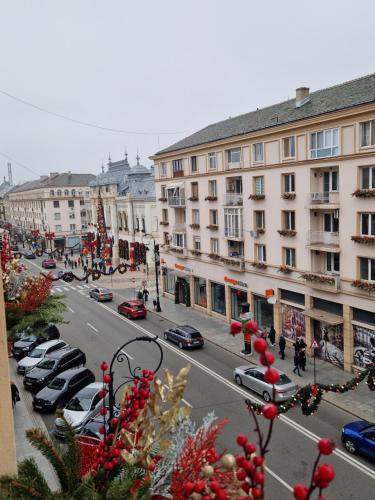 a city street with cars parked on the street at Cuza Residence in Craiova