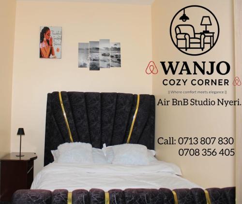 Кровать или кровати в номере Wanjo Cozy Corner