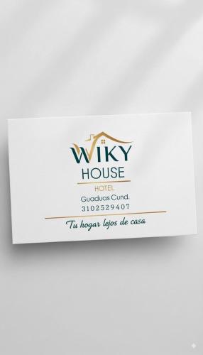 a white envelope with the wixy house logo at Apartamento central Wiky House in Guaduas