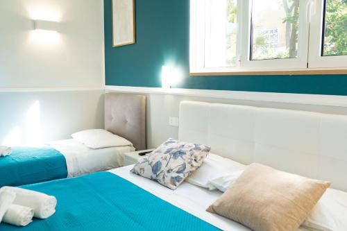 Ένα ή περισσότερα κρεβάτια σε δωμάτιο στο Royal Rooms Portici