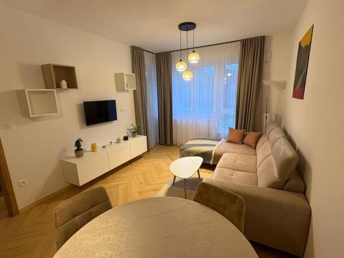 TV a/nebo společenská místnost v ubytování Kamence apartment