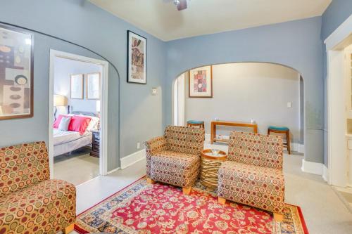 a living room with two chairs and a mirror at 1 Mi to Lake Michigan! Urban Racine Apartment in Racine