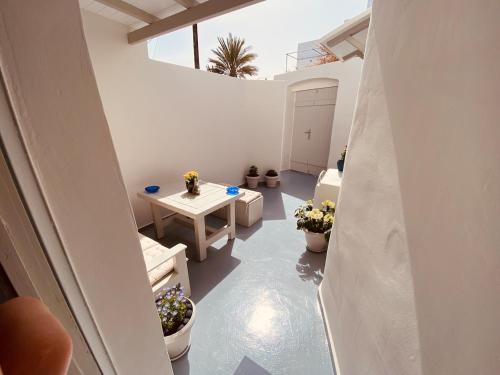 a view of a room with a table and flowers at Odysseas Traditional house in Mesaria