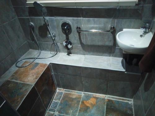 a bathroom with a shower and a sink at Mangrove Beach Estate, Dadda's Place, 321 Bokmakierie WY in Melville