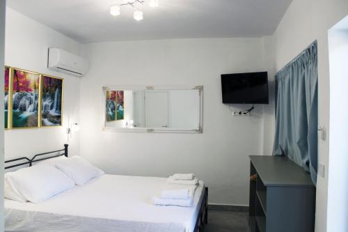 Postel nebo postele na pokoji v ubytování Aenaon Corfu Luxury Apartments #03 - Aris Apartment