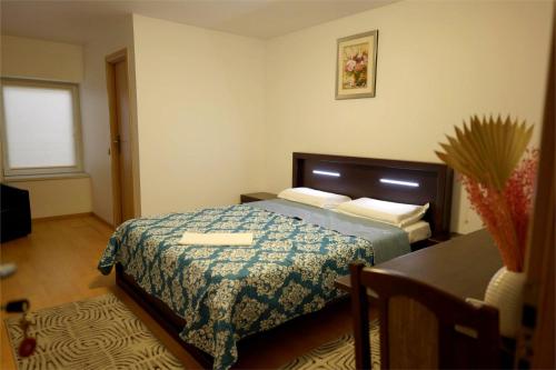 Ліжко або ліжка в номері Hotel Mina