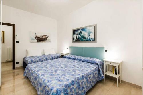 Habitación de hotel con 2 camas en un dormitorio en The Gateway en Bolonia